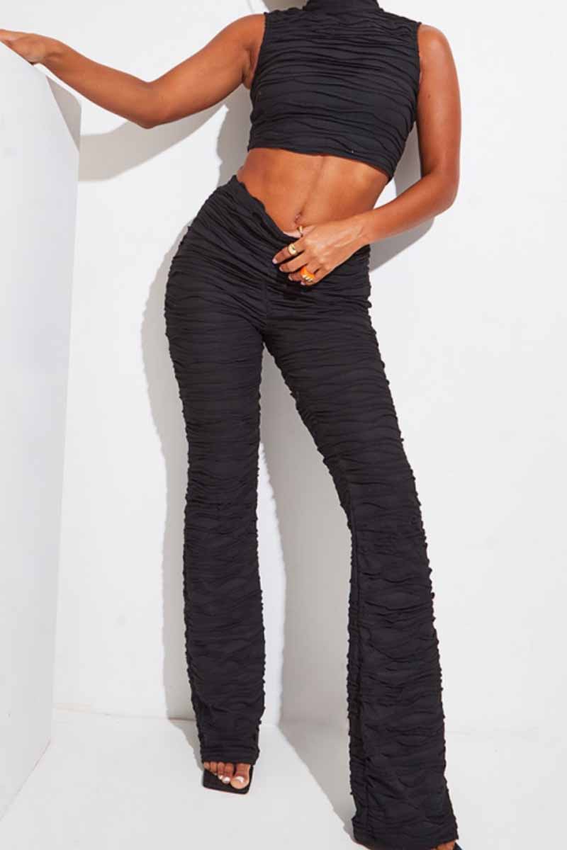 Priya - Elegante completo con top plissettato smanicato e pantaloni a gamba larga