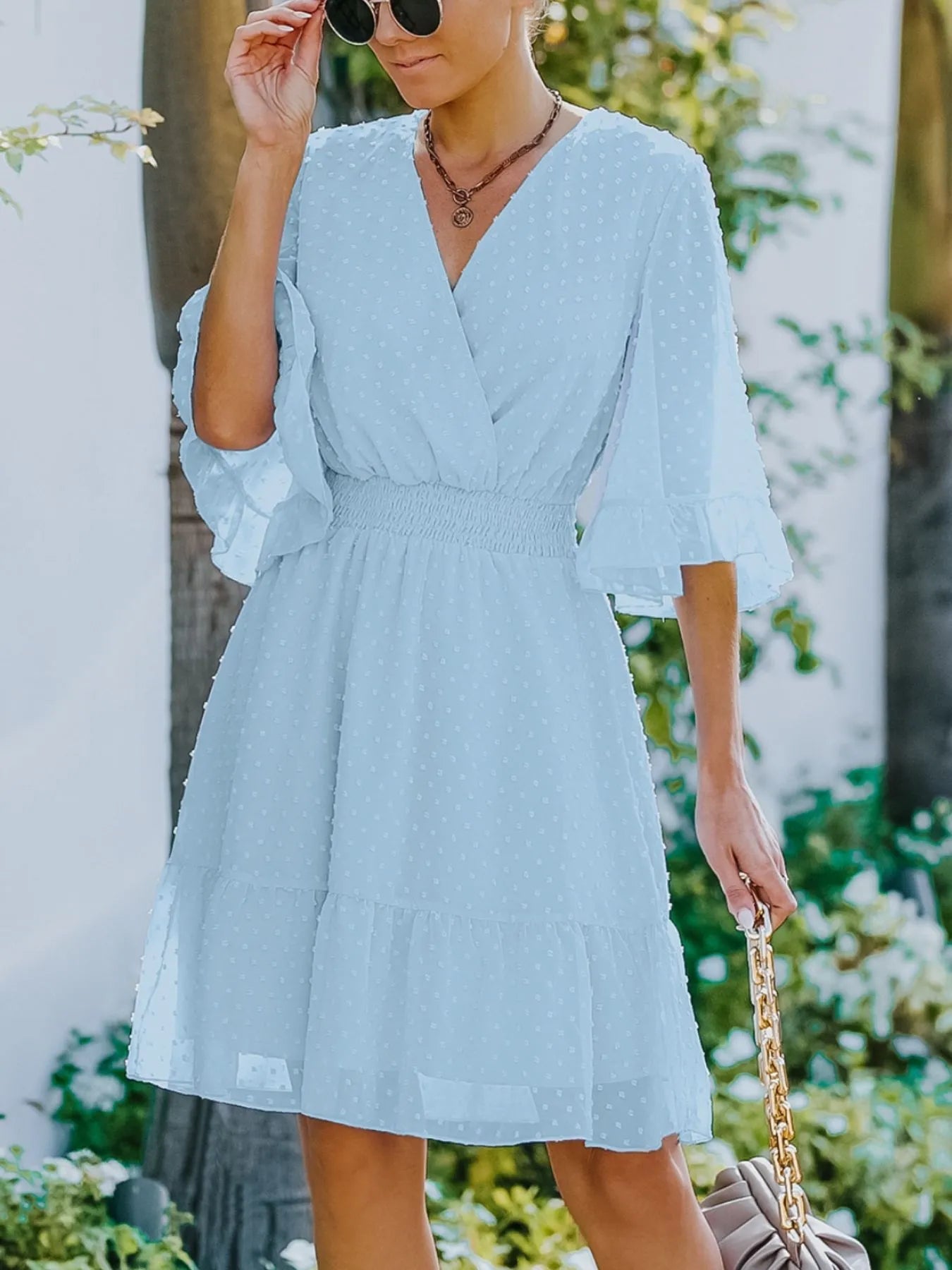 Kelsey - Elegante mini abito in tessuto Swiss Dot con maniche svasate