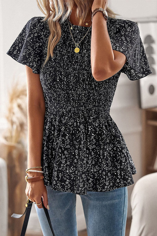 Louisa - Elegante blusa floreale a maniche corte con orlo a balze