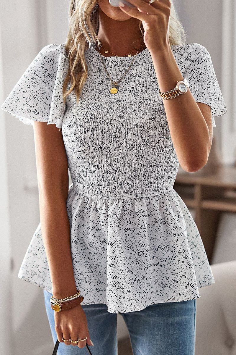 Louisa - Elegante blusa floreale a maniche corte con orlo a balze