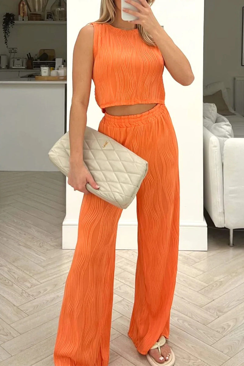 Rina - Completo elegante con top smanicato e pantaloni a vita alta