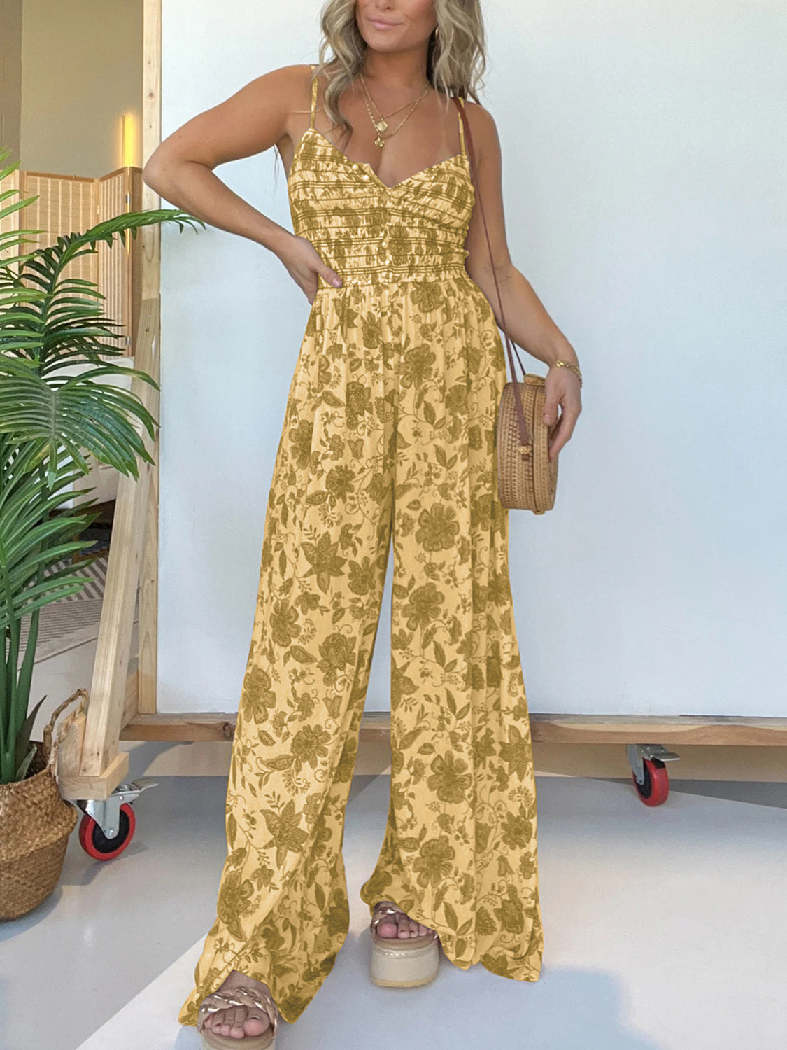 Jana - Elegante tuta floreale con spalline sottili e gamba larga