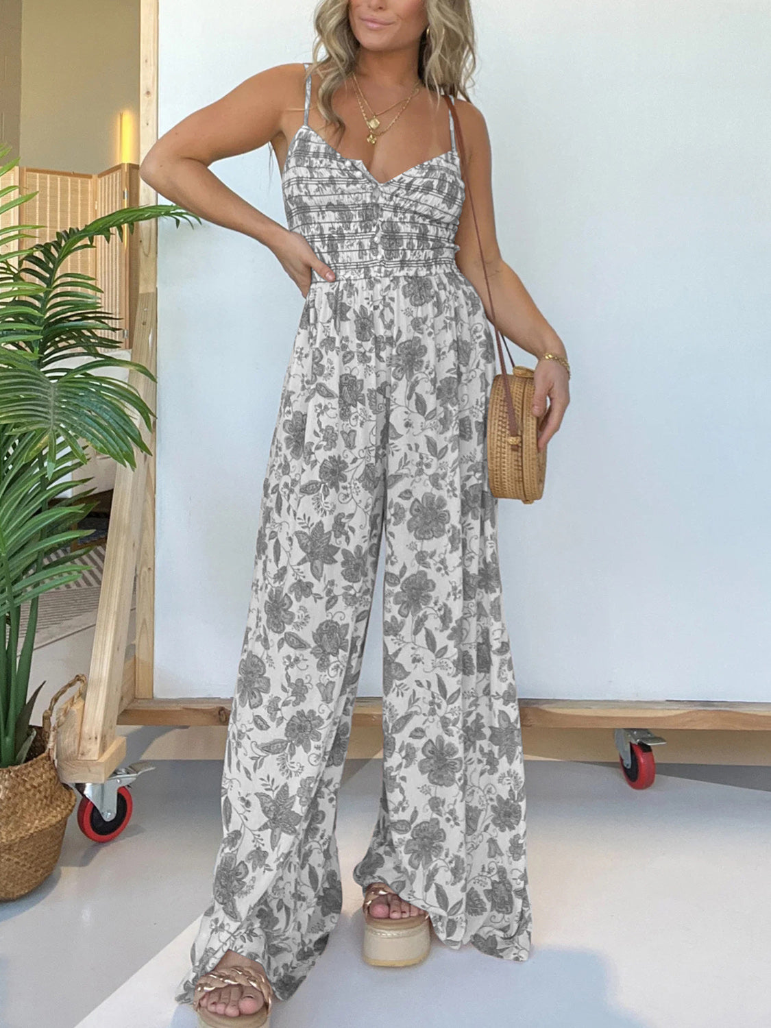 Jana - Elegante tuta floreale con spalline sottili e gamba larga