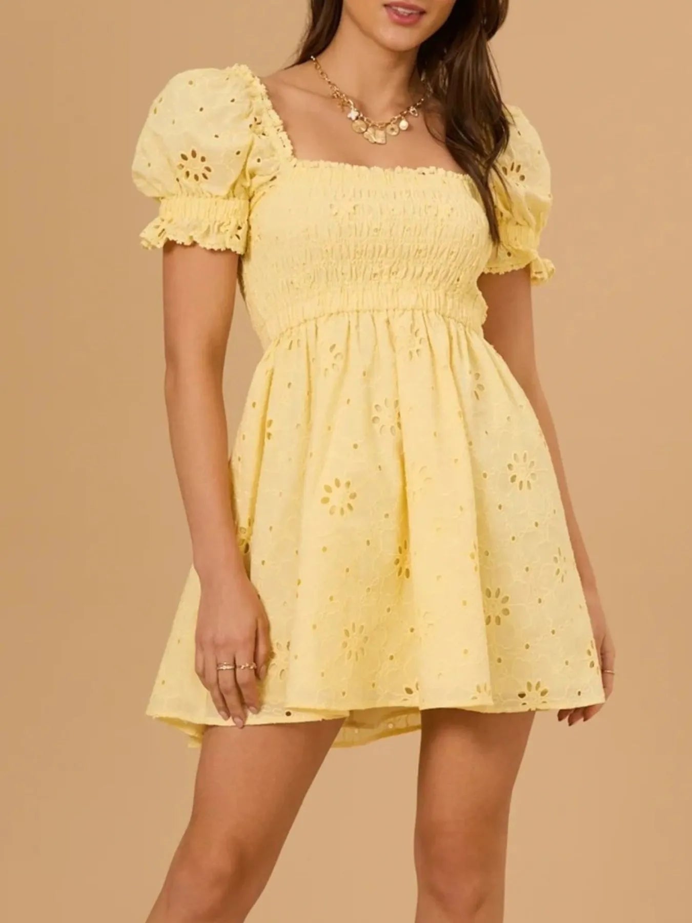 Emily - Minidress con maniche a sbuffo e schiena scoperta