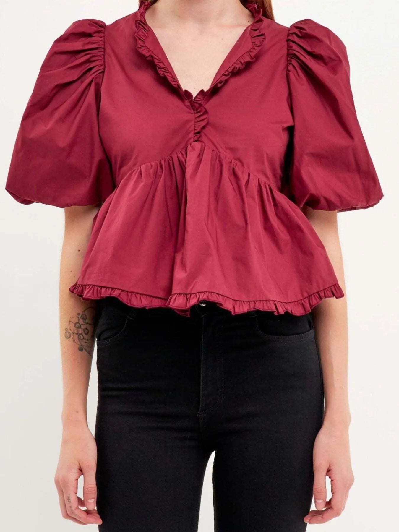 Kath - Elegante blusa peplum con maniche a sbuffo