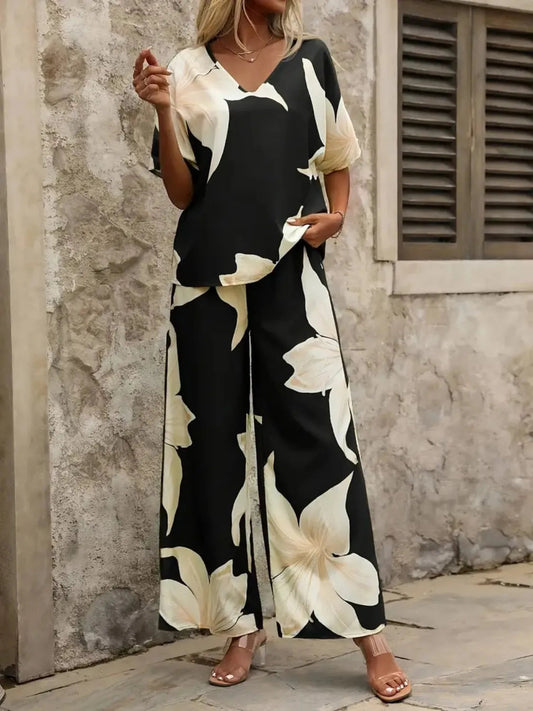 Estelle - Elegante completo con blusa scollo a V e pantaloni a gamba larga con stampa floreale
