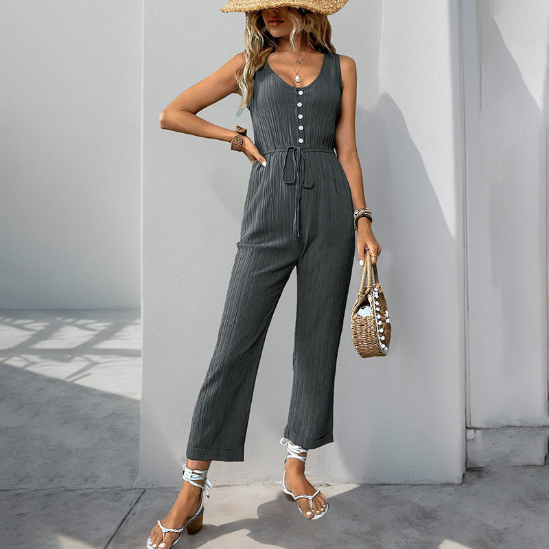 Nora - Tuta smanicata con bottoni dal look casual