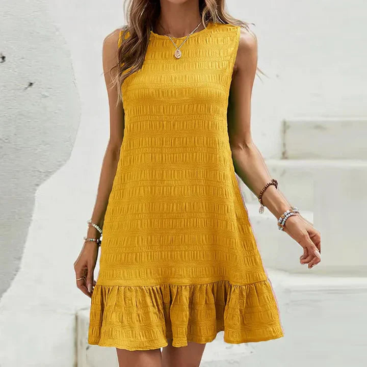 Milena - Elegante minidress senza maniche con volant sull’orlo