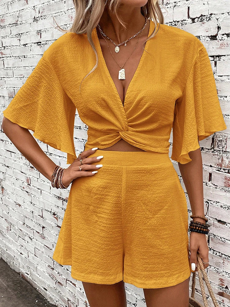 Vasilina - Completo elegante con top e pantaloncini con scollo a V profondo e maniche pipistrello