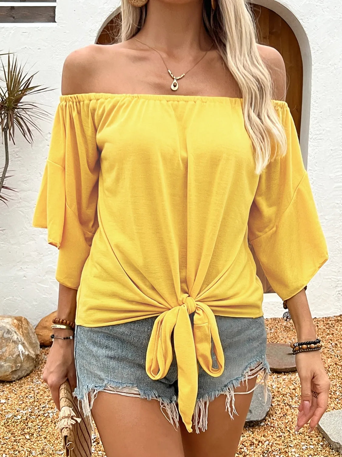 Gwen - Elegante blusa con spalle scoperte e fiocco morbido