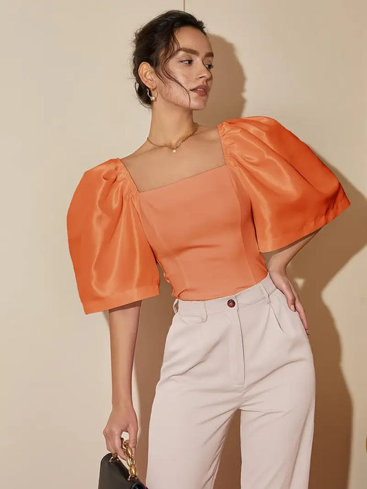 Connie - Elegante top con maniche a sbuffo e scollo quadrato