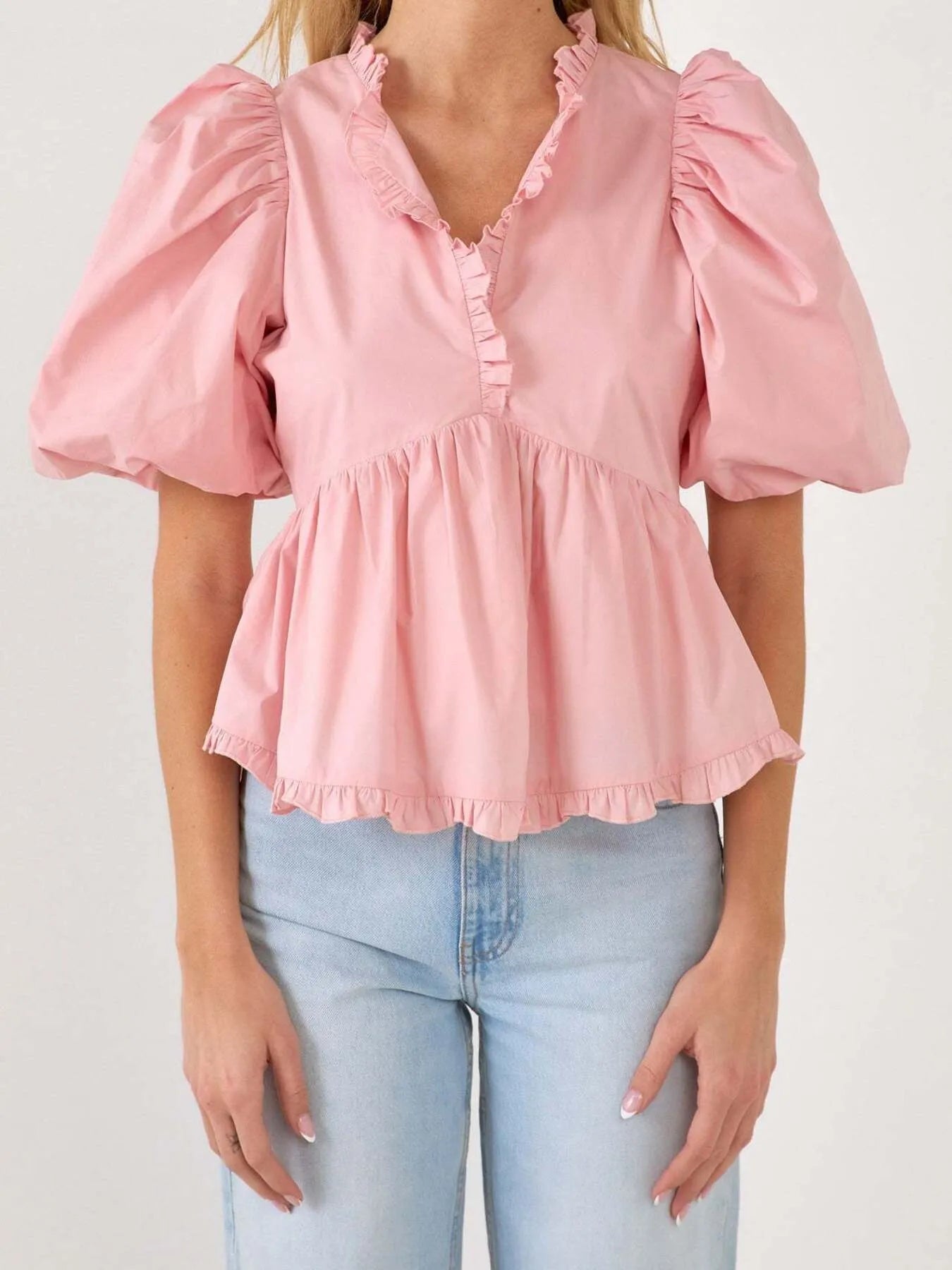 Kath - Elegante blusa peplum con maniche a sbuffo