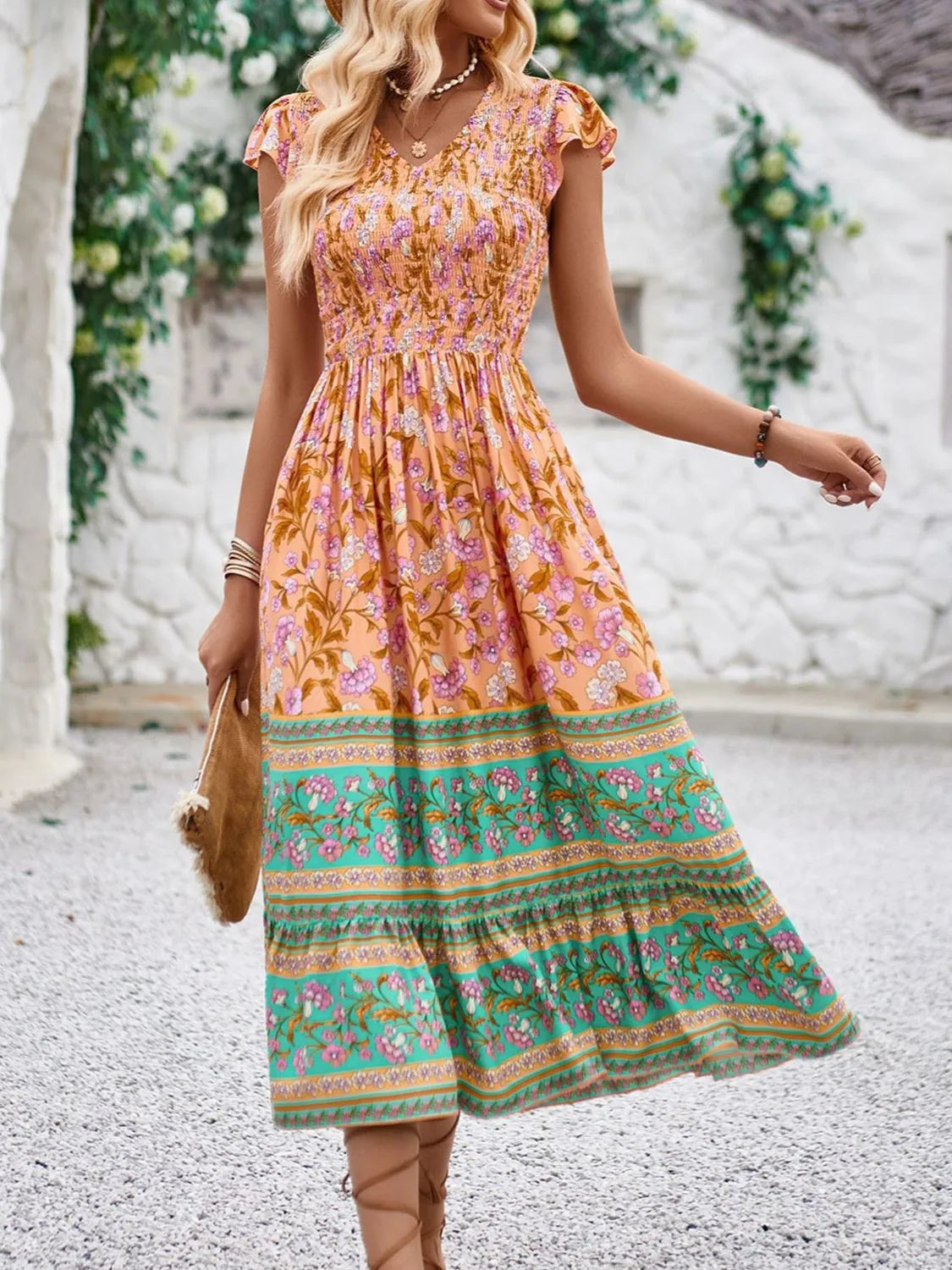 Cassandra - Elegante abito floreale con maniche a cappuccio